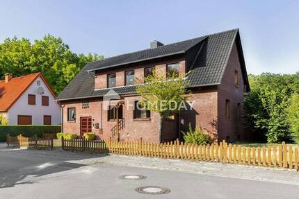 Naturnahes Wohnen: Attraktives Ein- bis Zweifamilienhaus mit großem Grundstück, Garage und Werkstatt 8 zimmer